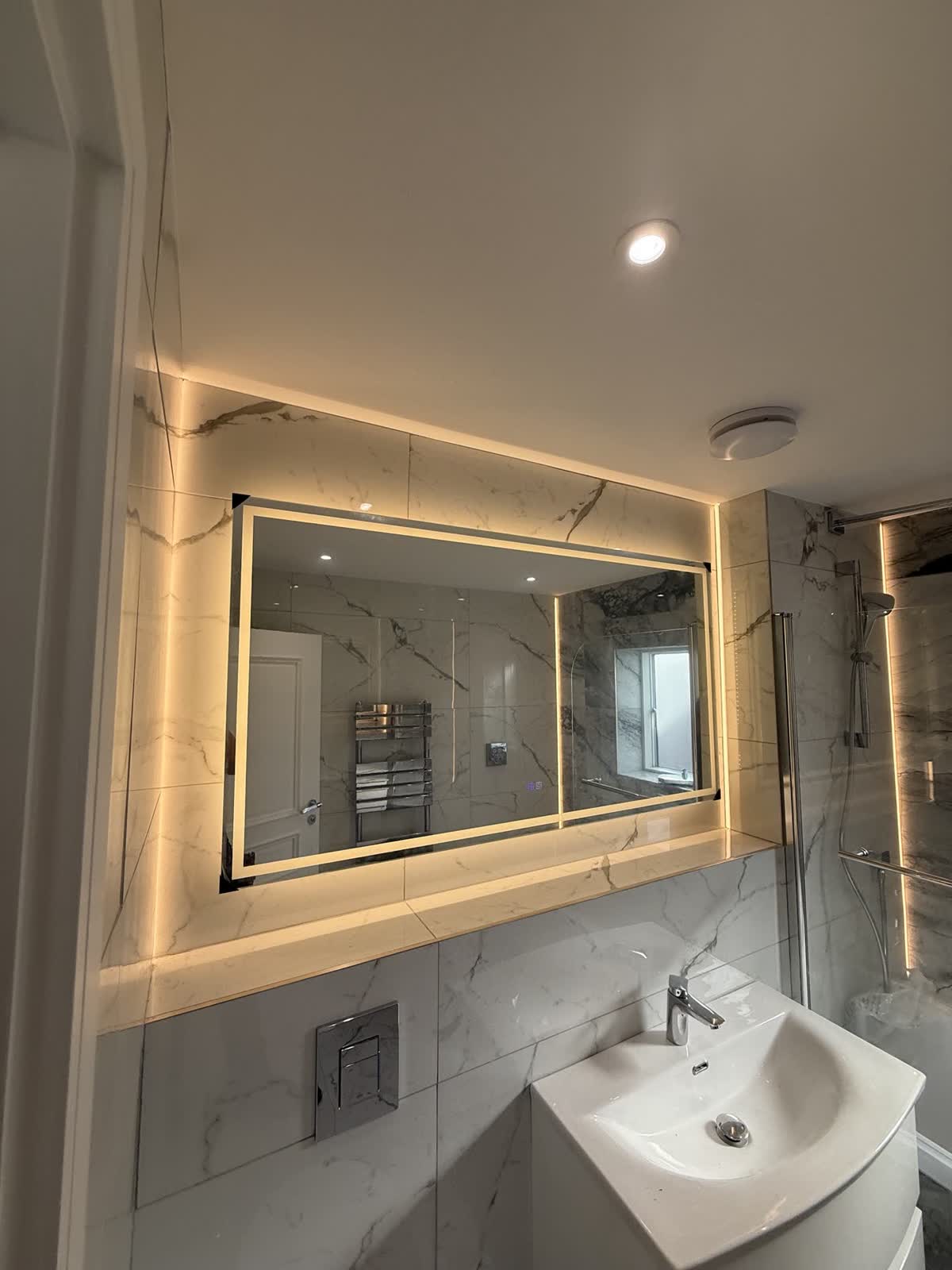 Backlit bathroom mirror