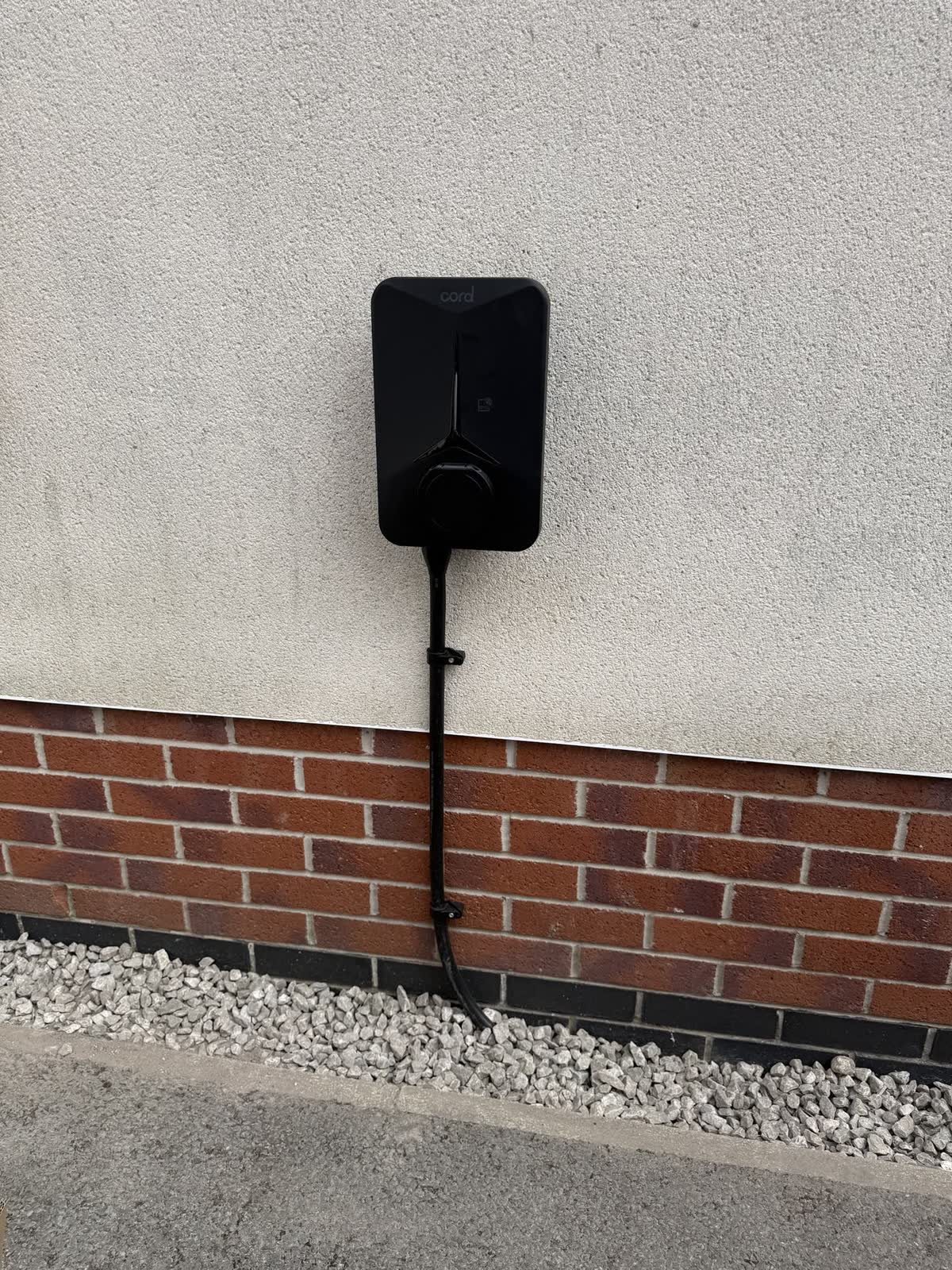 EV charger on a rendered wall