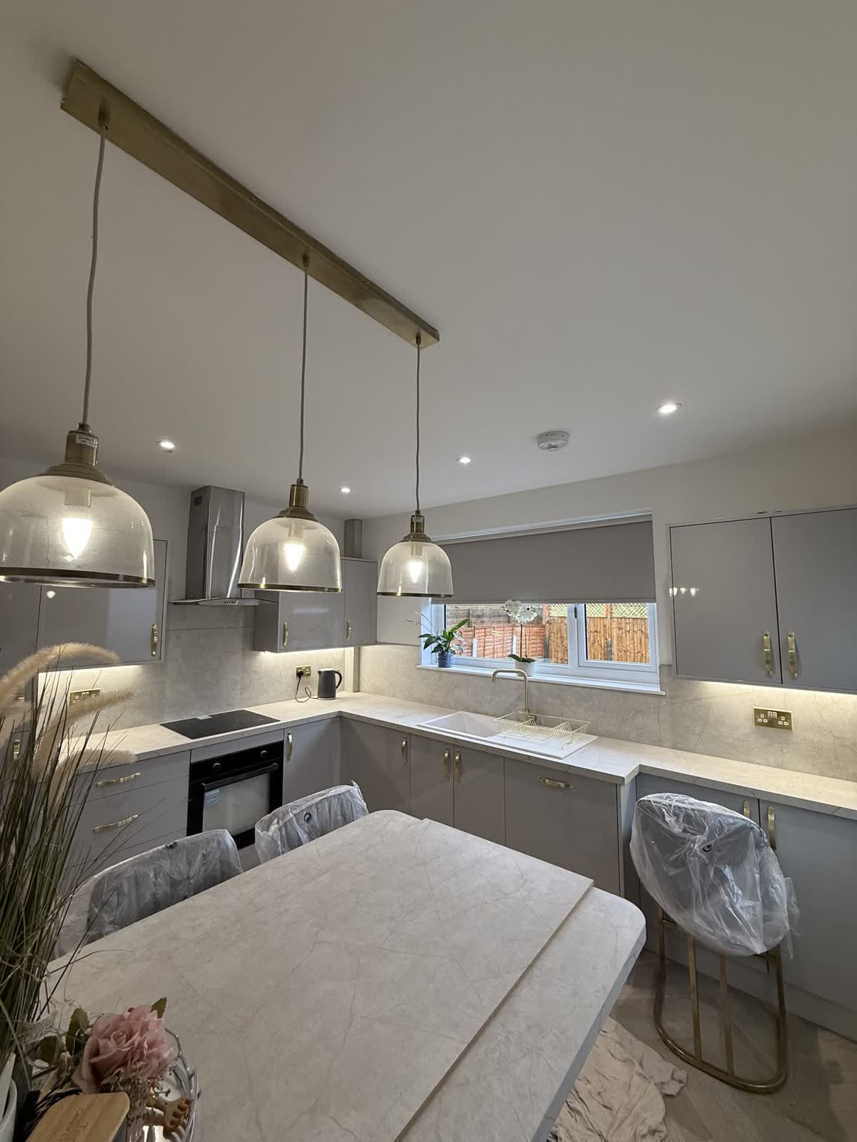 Glass pendants over an island